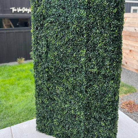 A full height faux greenery wall - available to rent by the Wildflower Denver, the premier wedding and event rental vendor. 